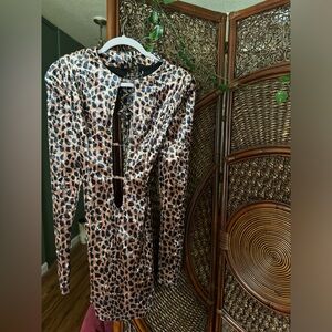 Never worn, low cut leopard dress.